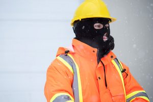 Man in Orange Hi viz Jacket wears a balaclava