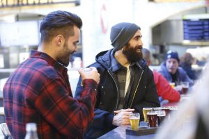 Two men converse wearing tough duck casual wear