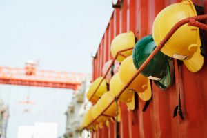 Hard hats hang up at a worksite